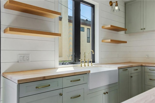 kitchen featuring wooden counters and sink