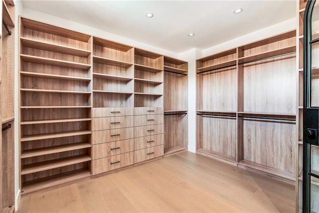 walk in closet featuring light hardwood / wood-style floors