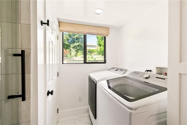 laundry area with washing machine and clothes dryer