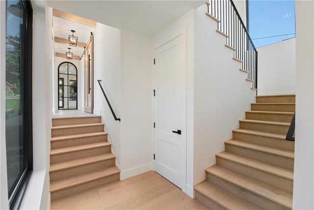 staircase featuring wood-type flooring