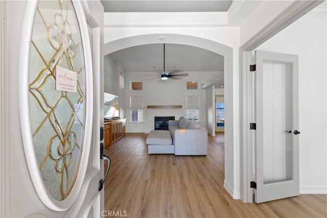 entryway featuring light wood-type flooring and ceiling fan