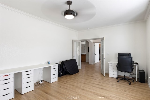 office space with crown molding, ceiling fan, and light hardwood / wood-style flooring