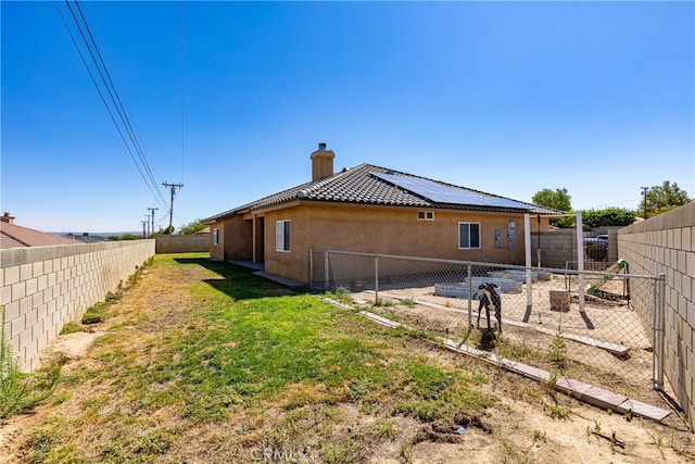 back of house with a yard