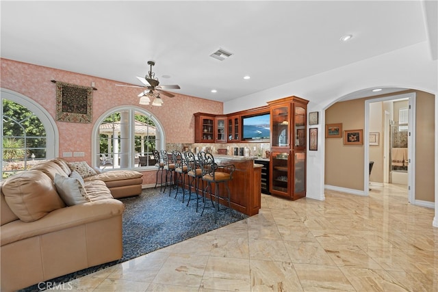 living room featuring ceiling fan