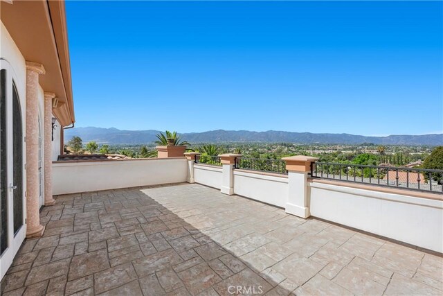 view of patio / terrace featuring a balcony and a mountain view