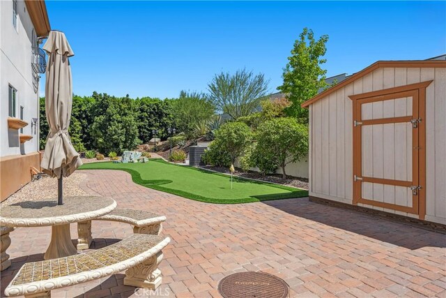 view of patio with a shed