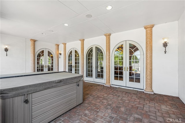 exterior space featuring french doors and a hot tub