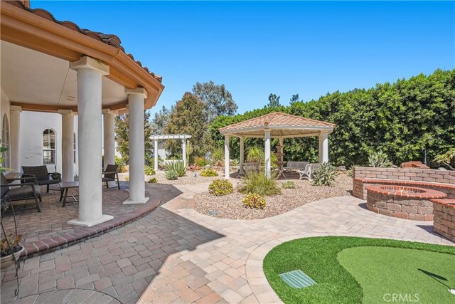 view of patio / terrace with a gazebo and an outdoor fire pit