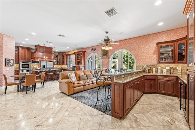 living room featuring ceiling fan