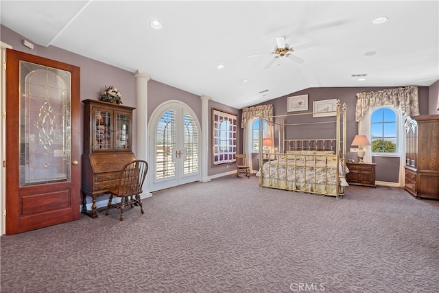 bedroom featuring ceiling fan, carpet, multiple windows, and vaulted ceiling