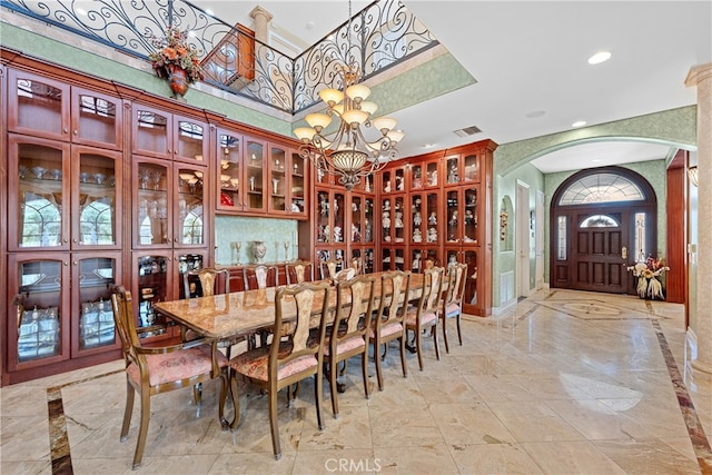 dining area with an inviting chandelier