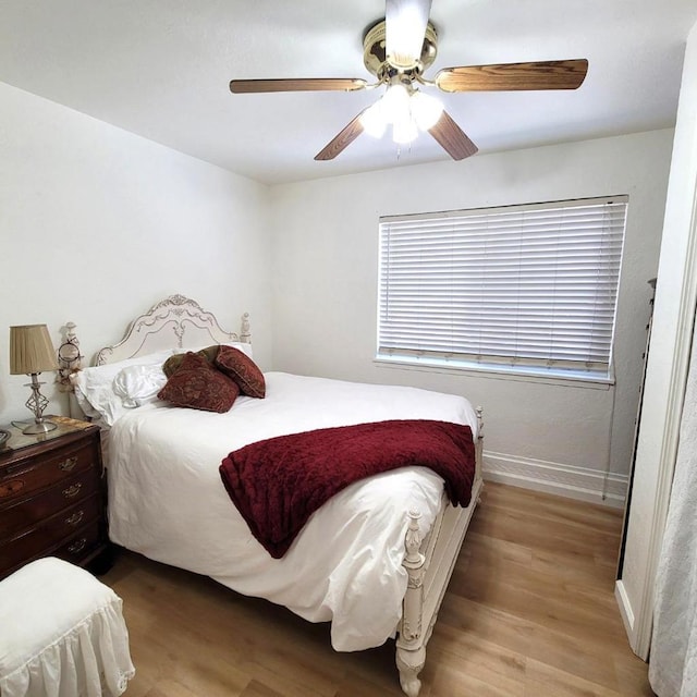 bedroom featuring ceiling fan and light wood-type flooring