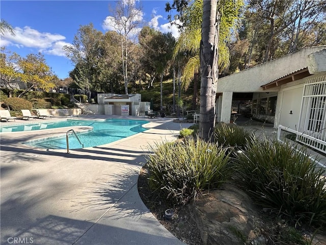 pool featuring a patio area