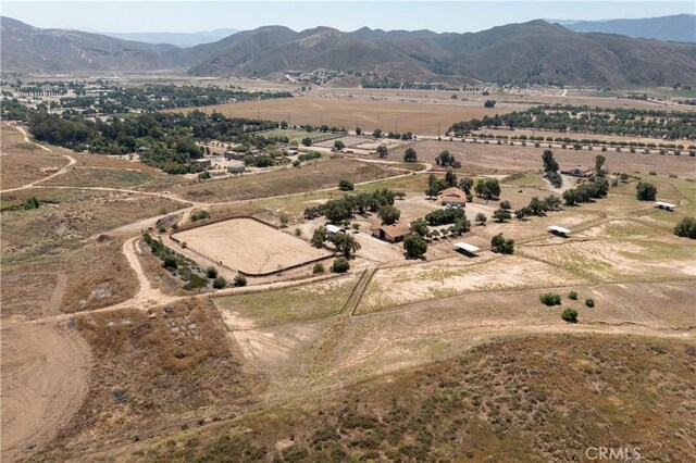 drone / aerial view with a mountain view and a rural view