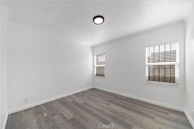 spare room featuring hardwood / wood-style flooring