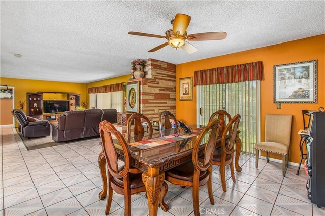 15937 Manzanita Dr, Fontana, CA 92335 - dining space featuring light tile patterned floors, a ceiling fan, and a textured ceiling