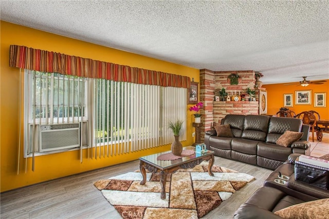 15937 Manzanita Dr, Fontana, CA 92335 - living room with cooling unit, a textured ceiling, ceiling fan, and wood finished floors