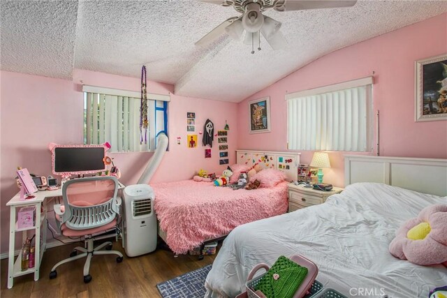 bedroom featuring a textured ceiling, vaulted ceiling, dark hardwood / wood-style floors, and ceiling fan