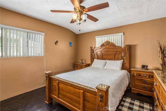 15937 Manzanita Dr, Fontana, CA 92335 - bedroom with dark wood finished floors, ceiling fan, and a textured ceiling