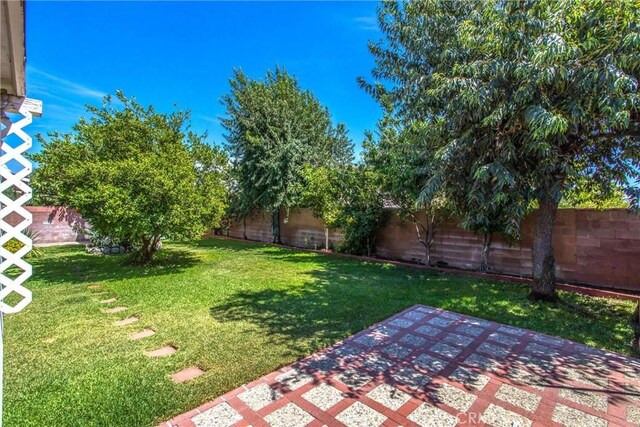 15937 Manzanita Dr, Fontana, CA 92335 - view of yard with a fenced backyard and a patio area