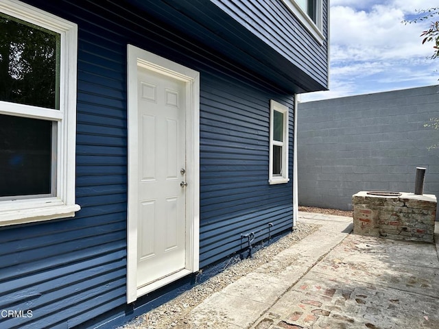 doorway to property with a patio area