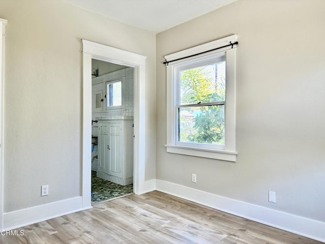 unfurnished bedroom featuring light wood-type flooring