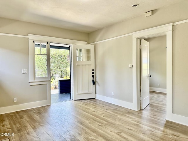 foyer entrance with light wood-type flooring