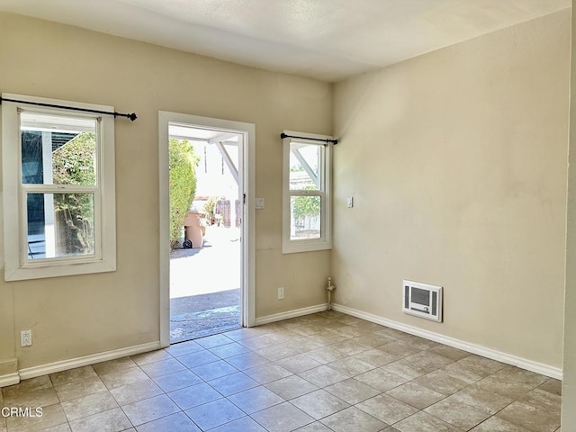 entryway featuring light tile patterned flooring