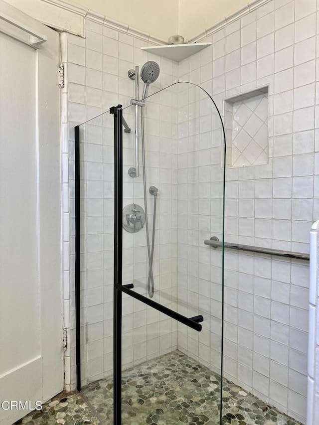 bathroom featuring an enclosed shower