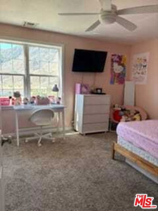 carpeted bedroom with ceiling fan