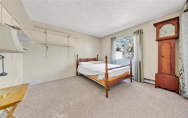 bedroom with light colored carpet, a textured ceiling, and a baseboard heating unit