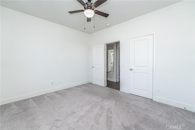 unfurnished bedroom featuring carpet and ceiling fan