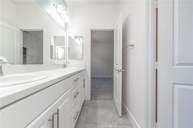 bathroom with tile patterned flooring and vanity