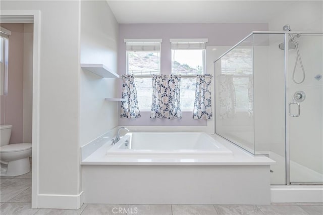 bathroom featuring tile patterned floors, toilet, and independent shower and bath