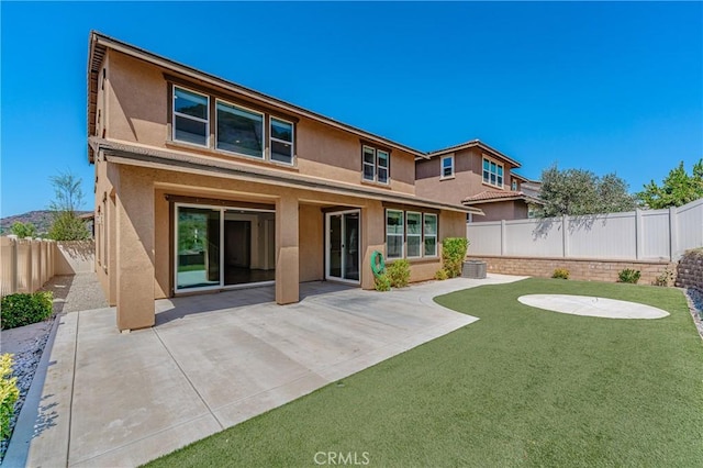 back of house featuring a patio area