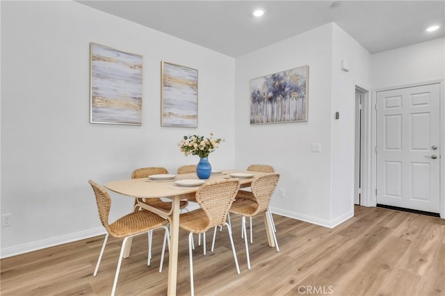 dining area featuring light wood-type flooring