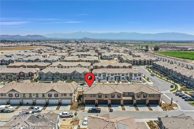 birds eye view of property with a mountain view