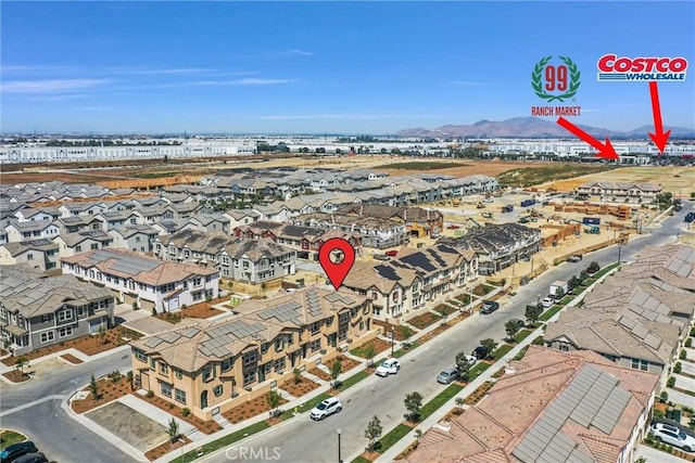 birds eye view of property featuring a mountain view