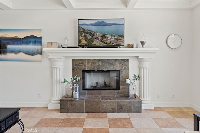 interior space with beamed ceiling and a tile fireplace