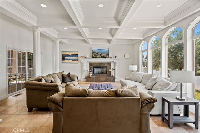 living room featuring crown molding, a tile fireplace, coffered ceiling, and beamed ceiling