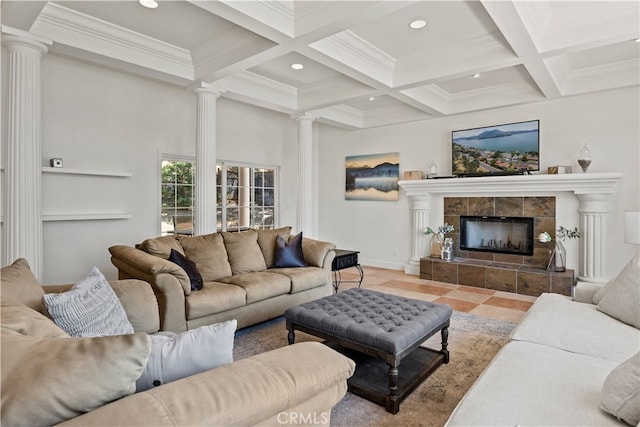 living room featuring ornamental molding, a tiled fireplace, beamed ceiling, and coffered ceiling