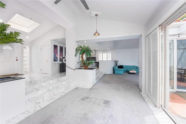 entrance foyer featuring recessed lighting, ceiling fan, and lofted ceiling with skylight