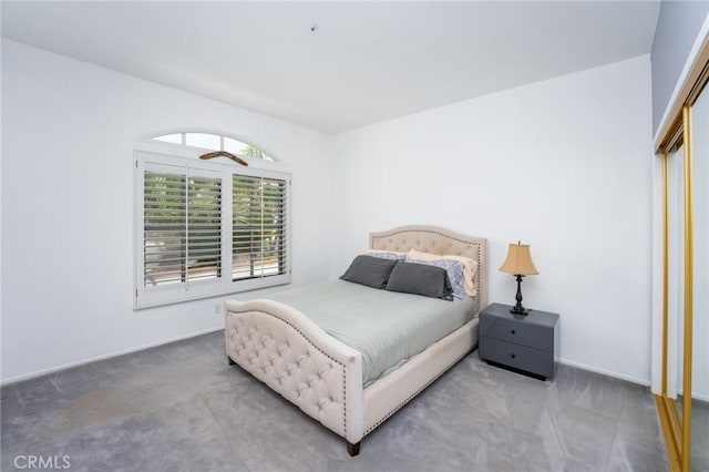 carpeted bedroom with baseboards