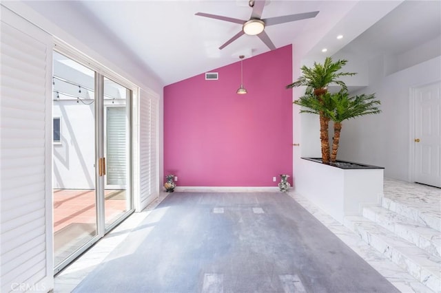 empty room with ceiling fan, a healthy amount of sunlight, and lofted ceiling