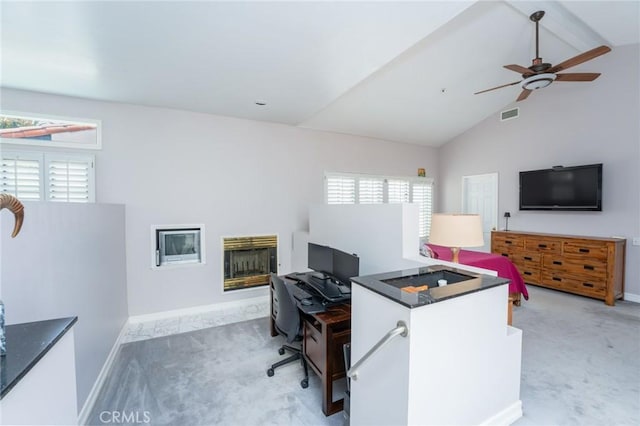 office area with carpet flooring, a fireplace, and a healthy amount of sunlight