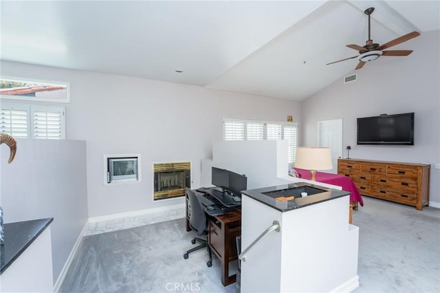 office area featuring light colored carpet, high vaulted ceiling, a ceiling fan, baseboards, and visible vents