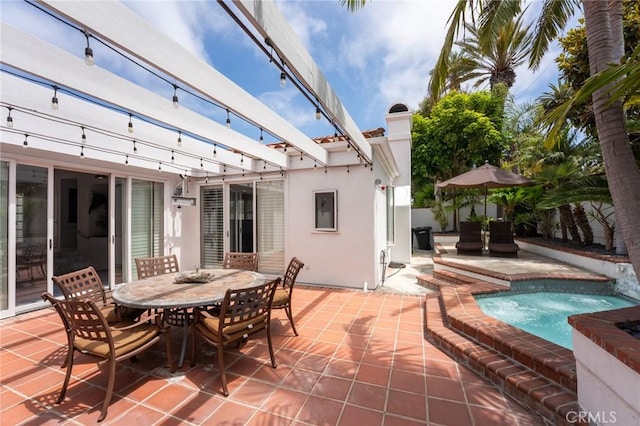 view of patio featuring a pergola and outdoor dining space