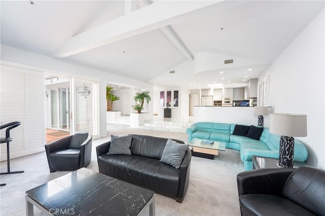 carpeted living room with vaulted ceiling with beams