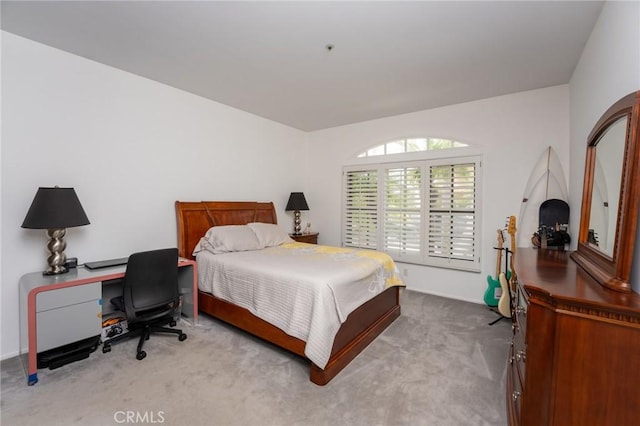 bedroom with baseboards and carpet flooring