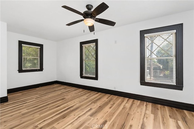 unfurnished room with ceiling fan and light hardwood / wood-style flooring